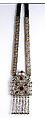 Amulet Holder, Silver and brass alloy; fire-gilded, with ram's-head terminals, loop-in-loop chains, bells, decorative wire, gilt-applied decoration, table-cut carnelians, and applique discs on leather